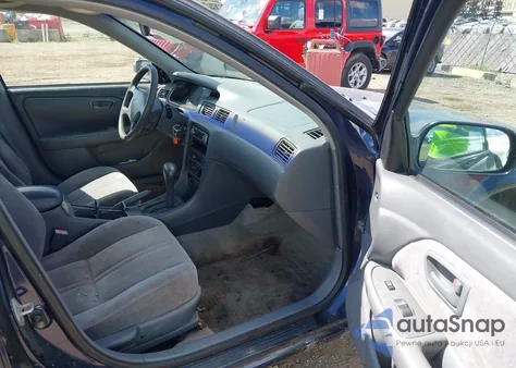 1999 Toyota Camry Le z USA, uszkodzony, nr VIN JT2BG22K9X0306177